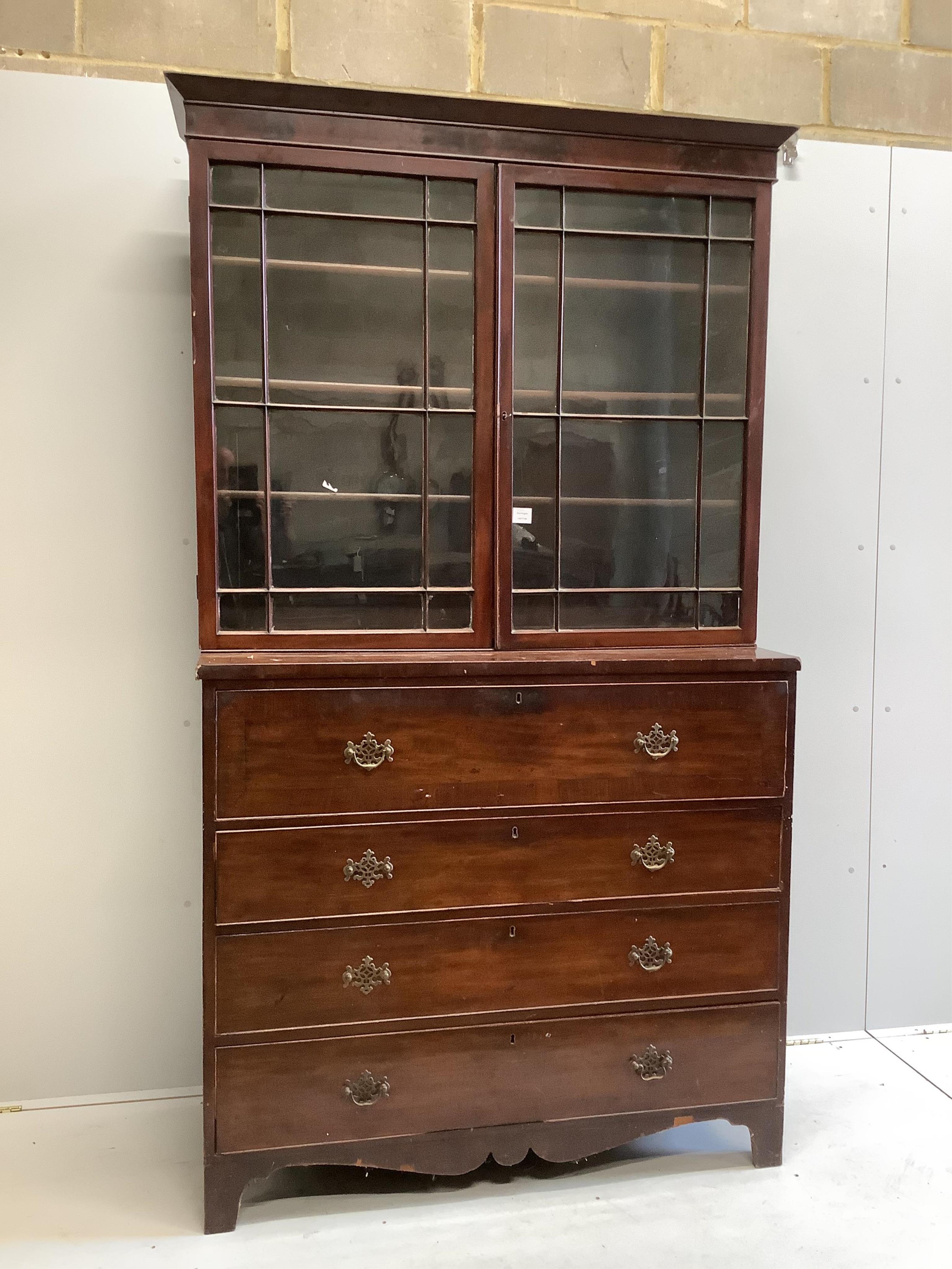 A Regency mahogany secretaire chest, with a later glazed bookcase over, width 121cm, depth 53cm, height 221cm. Condition - poor